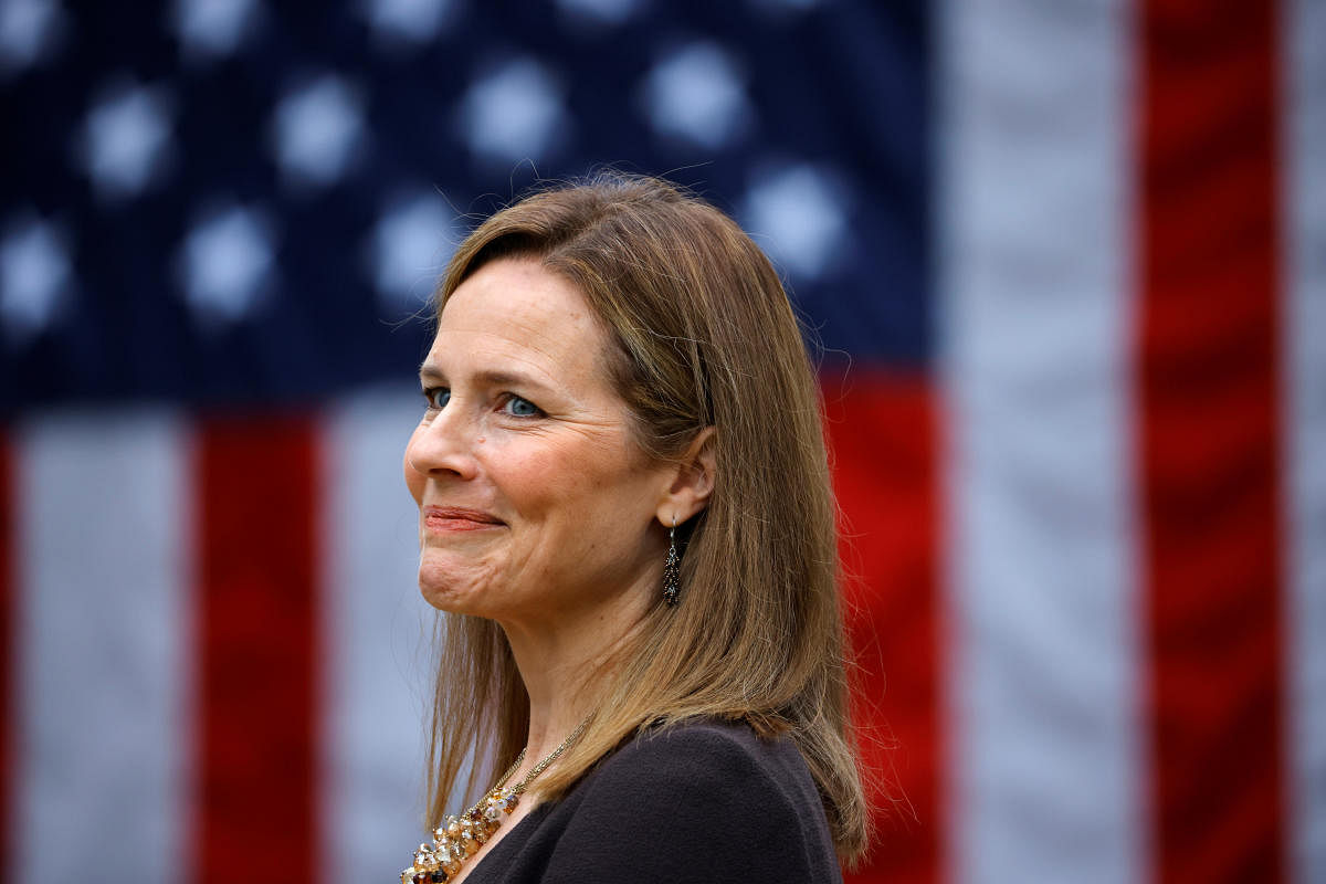 US Court of Appeals for the Seventh Circuit Judge Amy Coney Barrett reacts as US President Donald Trump holds an event to announce her as his nominee to fill the Supreme Court seat left vacant by the death of Justice Ruth Bader Ginsburg, who died on September 18, at the White House in Washington, US. Credit: Reuters Photo