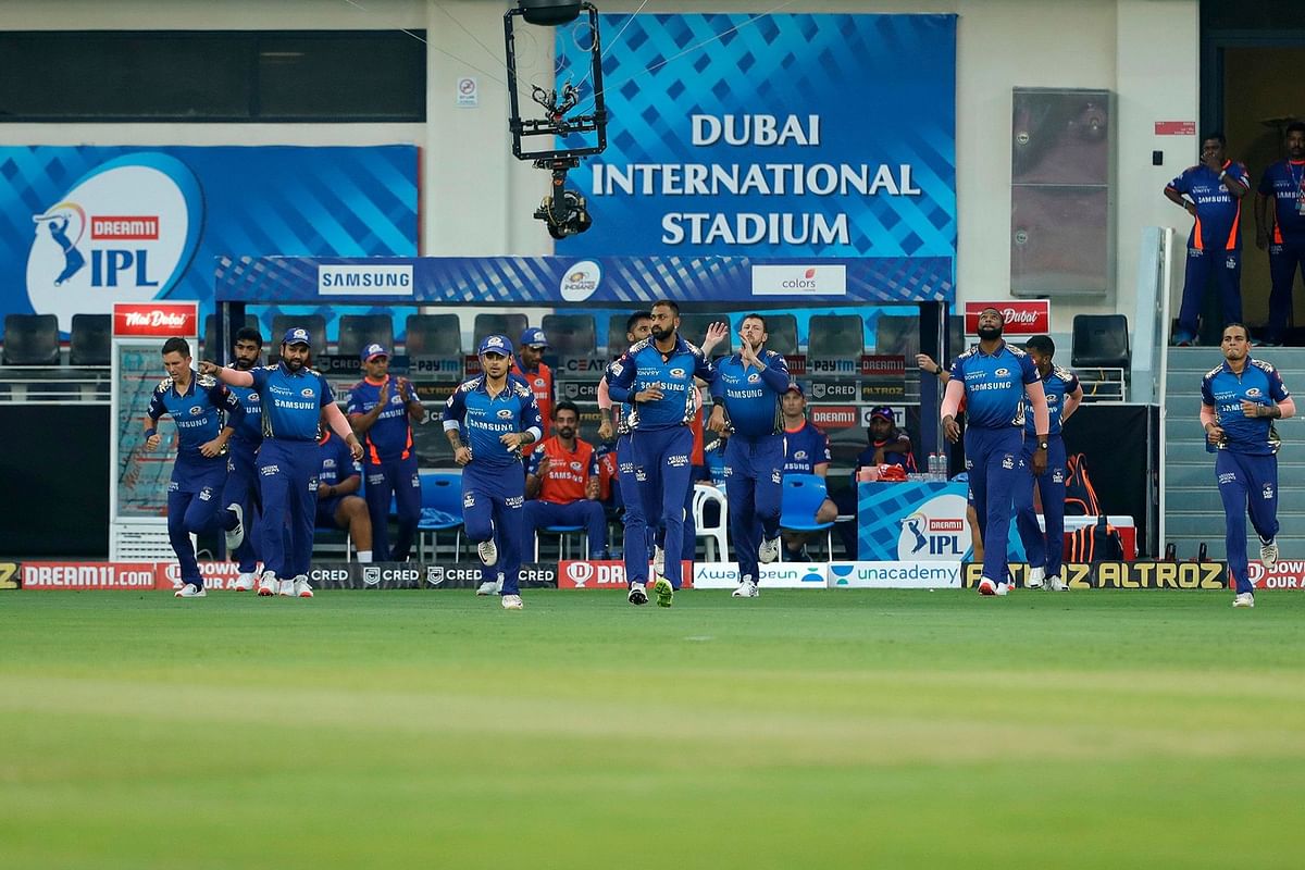 The Mumbai Indians enter the field during the IPL match against the Royal Challengers Bangalore at the Dubai International Cricket Stadium. Credit: iplt20.com, BCCI