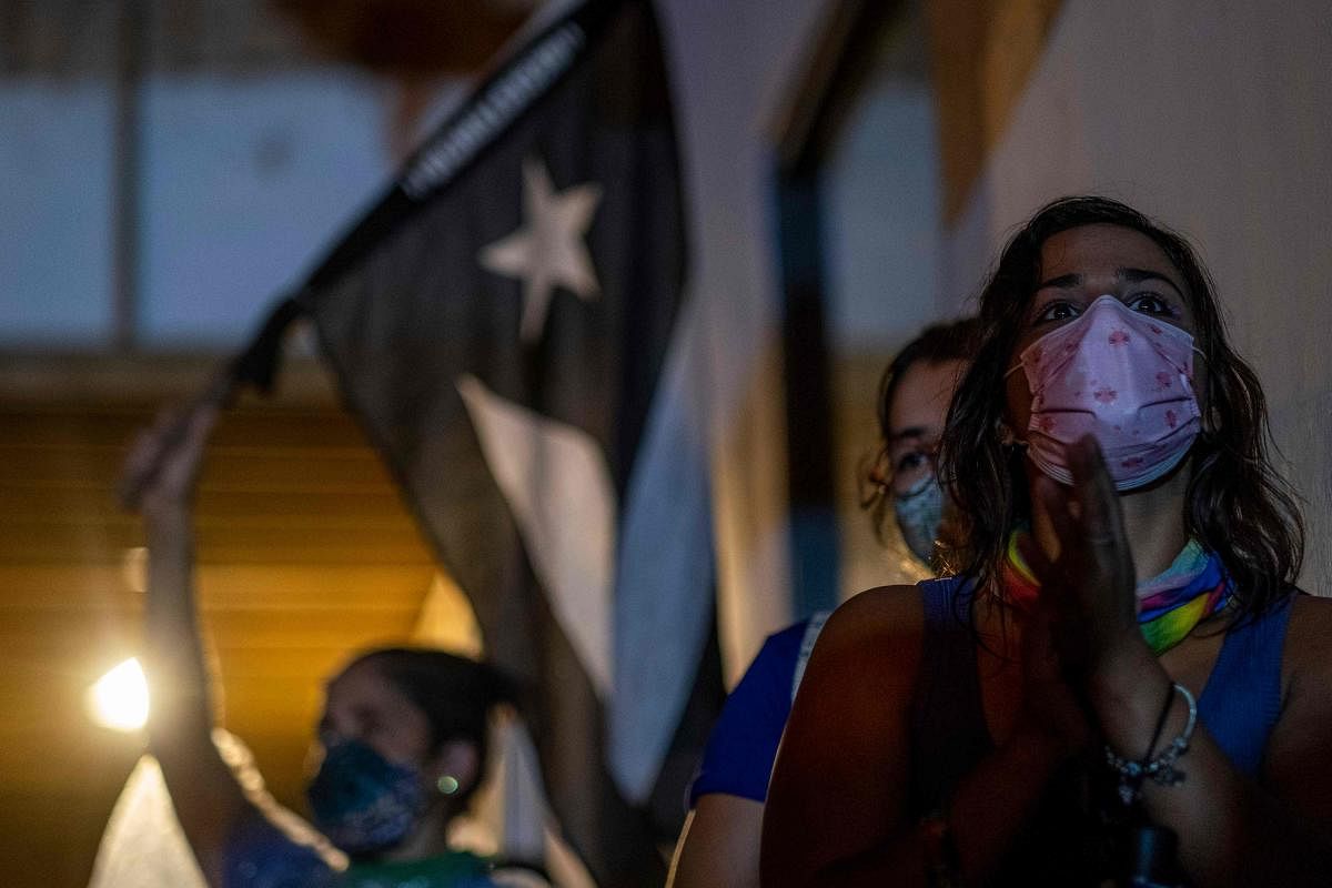 People led by the activist group, Feminist Collective, protest to demand Governor Wanda Vazquez to declare a state of emergency in response to recent gender-based, femicides, assaults, and the disappearance of women in San Juan, Puerto Rico. Credit: AFP Photo
