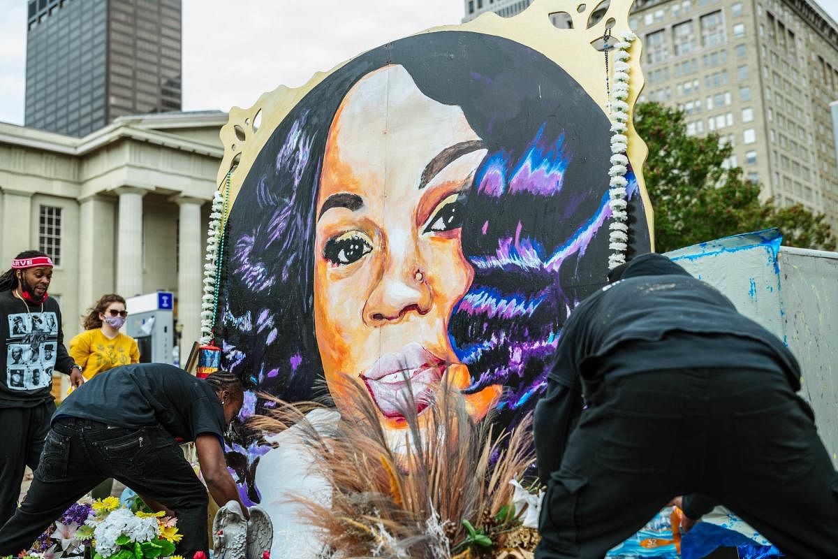 Demonstrators maintain the decorations around the Breonna Taylor memorial in Jefferson Square Park on September 30, 2020 in Louisville, Kentucky. Credit: AFP