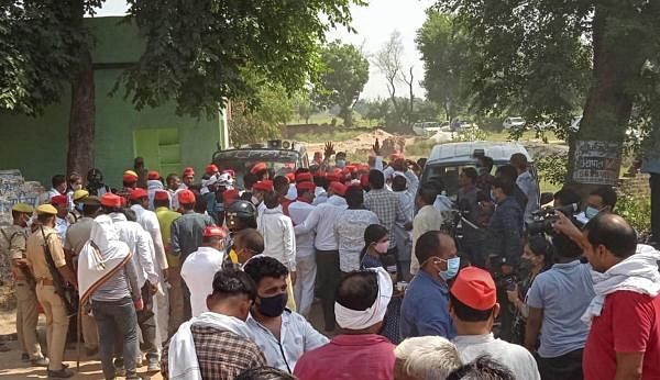 Samajwadi party workers during a protest at Bulgadi village in Hathras district. Credit: PTI Photo