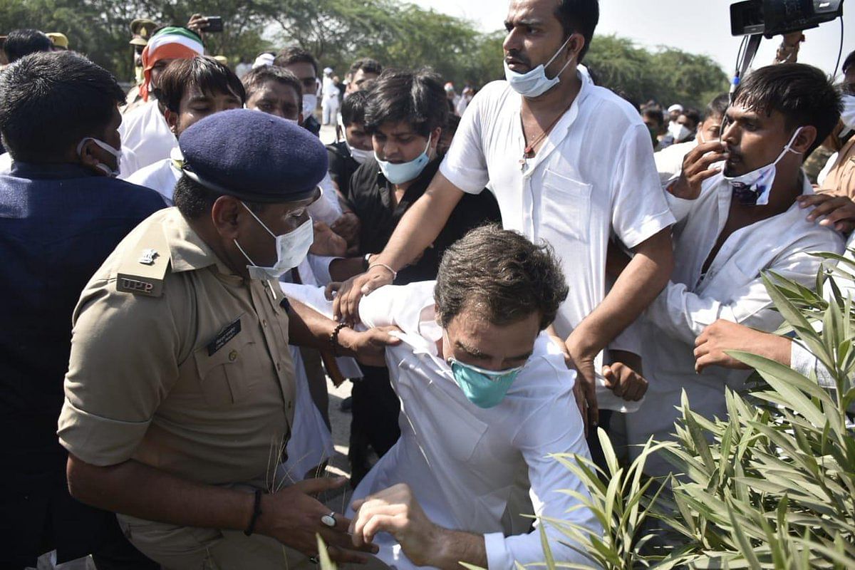 Rahul Gandhi slumps after police personnel allegedly manhandled him while he was on his way to Hathras along with party workers to meet the family members of a 19-year-old Dalit woman who was murdered and gang-raped two weeks ago after his vehicle was stopped by the authorities, at Yamuna Expressway in Noida, Thursday, Oct. 1, 2020. Credit: Special Arrangement