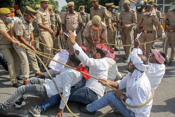 Police personnel lathi-charge on Samajwadi Party workers protesting over the death of Hathras gang-rape victim, in Lucknow, Wednesday. Credit: PTI Photo