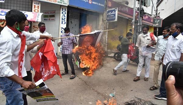 Members of AIAWU and AIKS burn a poster during a protest against the death of a 19-year-old Dalit woman in Hyderabad, on Oct. 1, 2020. Credit: PTI Photo