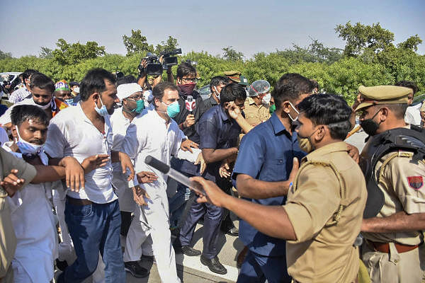 Congress leader Rahul Gandhi on his way to Hathras along with party workers to meet the family members of a 19-year-old Dalit woman who was murdered and gang-raped two weeks ago after his vehicle was stopped by the authorities, at Yamuna Expressway in Noida, Thursday. Credit: PTI Photo