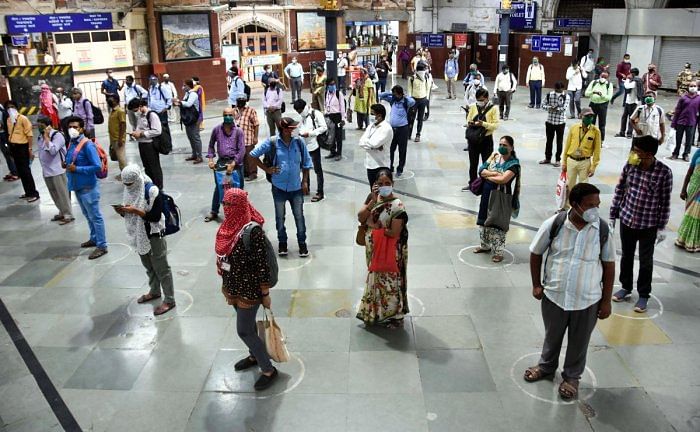 A railway engineer developed a device to remind people to maintain at least a three metre distance from each other. The device can fit into a pocket or a small purse, can be attached with ID cards and can also be used along with a wristwatch. Credit: PTI Photo