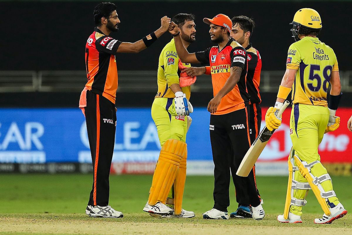 Players of Sunrisers Hyderabad and Chennai Super Kings shake hands after the match during the Indian Premier League 2020. Credit: PTI