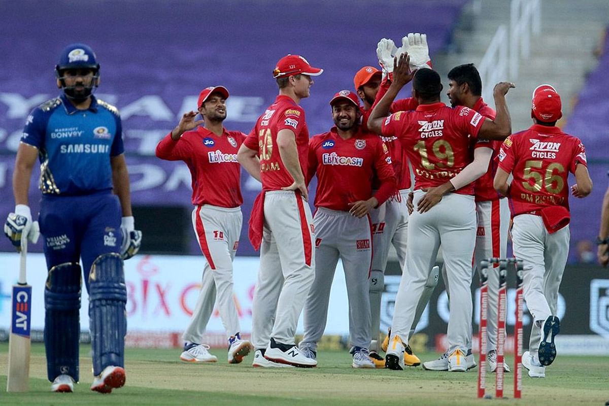 Kings XI Punjab players celebrates the wicket of Quinton de Kock of Mumbai Indians during the Indian Premier League (IPL) between the Kings XI Punjab and the Mumbai Indians at the Sheikh Zayed Stadium, Abu Dhabi in the United Arab Emirates on the 1st October 2020. Credit: iplt20.com, BCCI