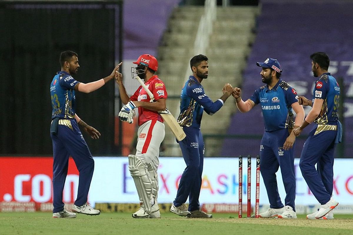 Mumbai Indians and Kings X1 Punjab players shake hands after the IPL 2020 match in Abu Dhabi. Credit: iplt20.com, BCCI
