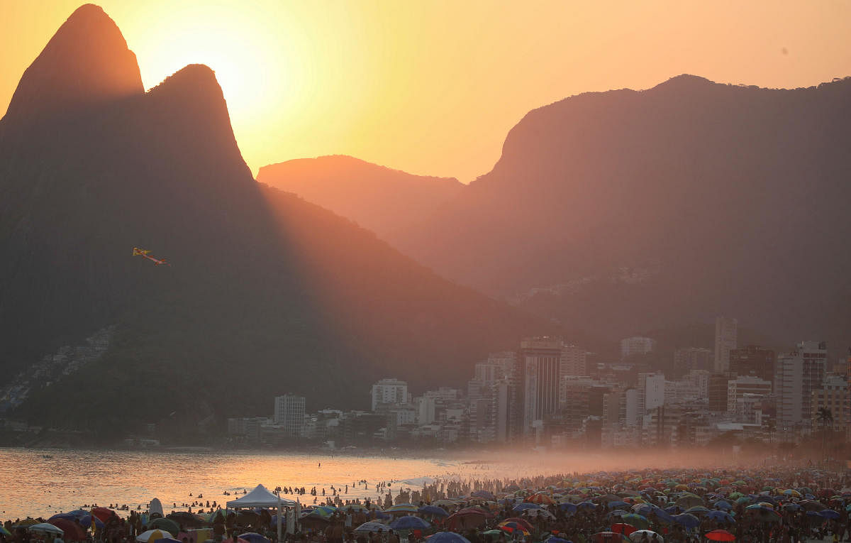 People enjoy Ipanema beach on the end of the day, which according to local media was the hottest day this year so far, amid the coronavirus outbreak, in Rio de Janeiro, Brazil. Credit: Reuters Photo