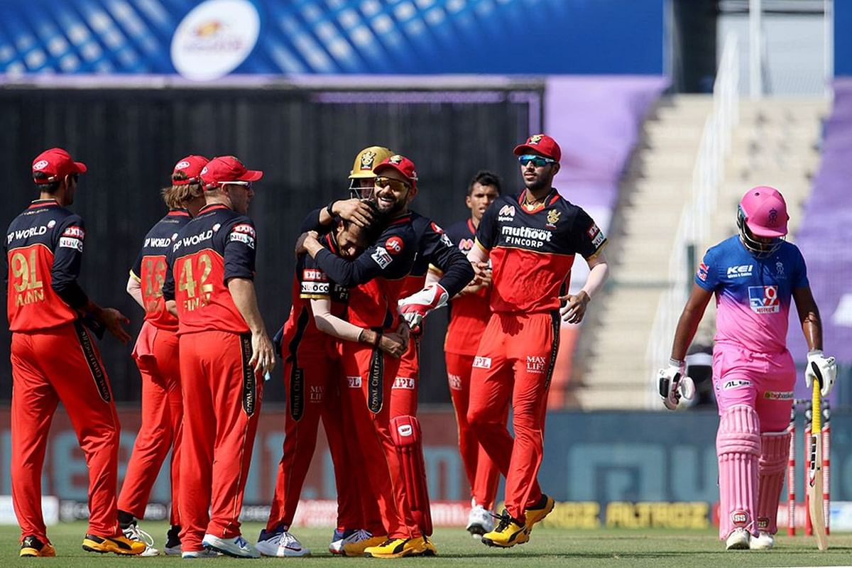 Royal Challengers Bangalore players celebrates the wicket of Sanju Samson of Rajasthan Royals during match 15 of season 13 of the Dream 11 Indian Premier League (IPL). Credit: IPL official website (www.iplt20.com)