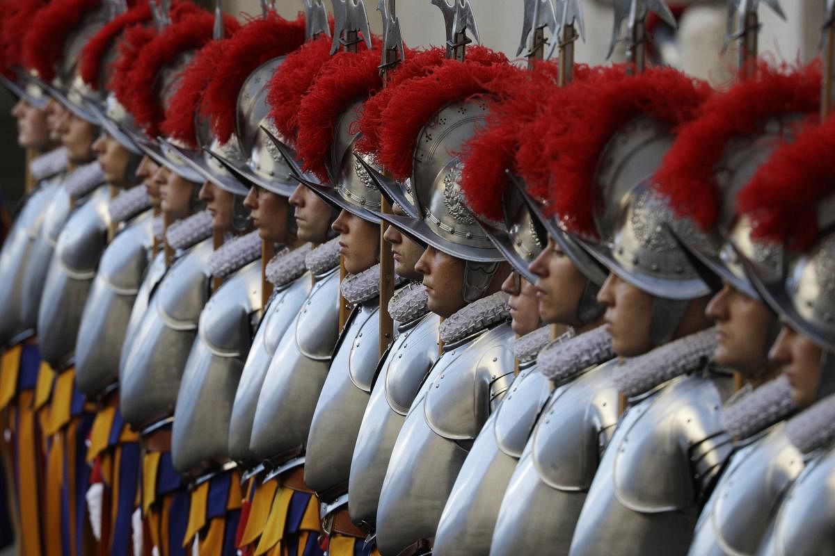 Vatican Swiss Guards arrive at the St. Damaso courtyard on the occasion of the swearing-in ceremony at the Vatican. The ceremony is held to commemorate the day in 1527 when 147 Swiss Guards died protecting Pope Clement VII during the Sack of Rome. Credit: AP Photo