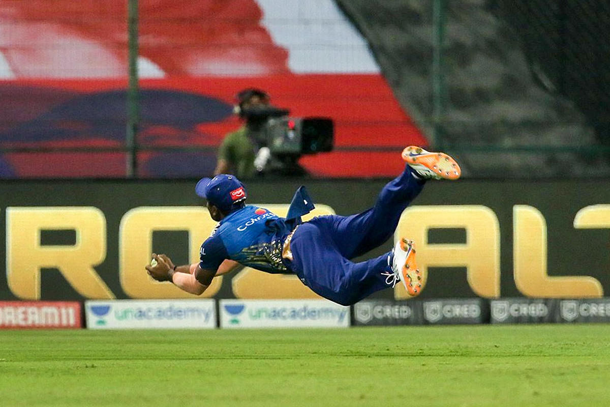 Mumbai Indians player Anukul Roy takes a catch of Mahipal Lomror of Rajasthan Royals during IPL 2020 cricket match, at Sheikh Zayed Stadium in Abu Dhabi, United Arab Emirates. Credit: PTI Photo