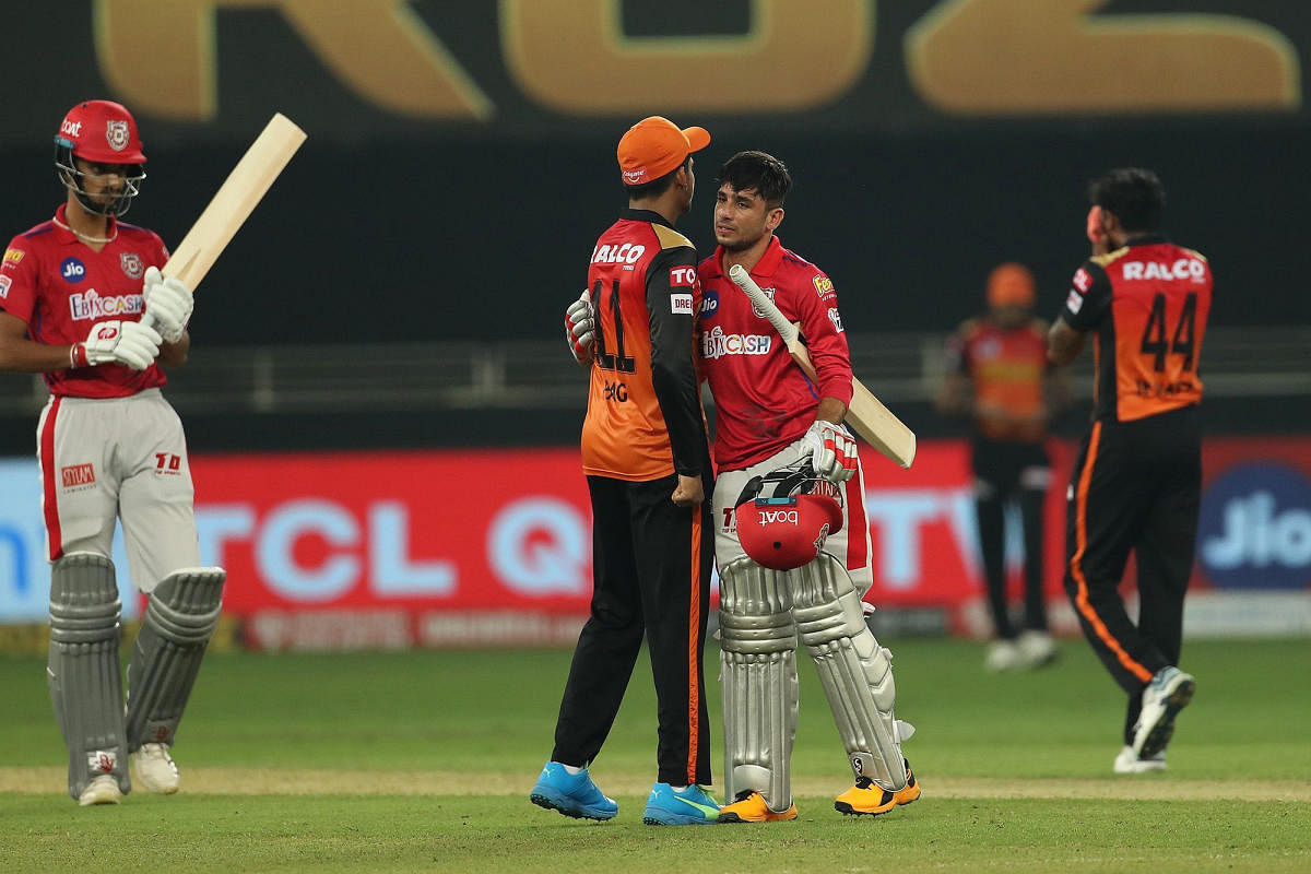 Kings XI Punjab and Sunrisers Hyderabad greet each other after the Indian Premier League 2020 cricket match, at Dubai International Cricket Stadium, in Dubai, Thursday, Oct. 8, 2020. Credit: PTI Photo