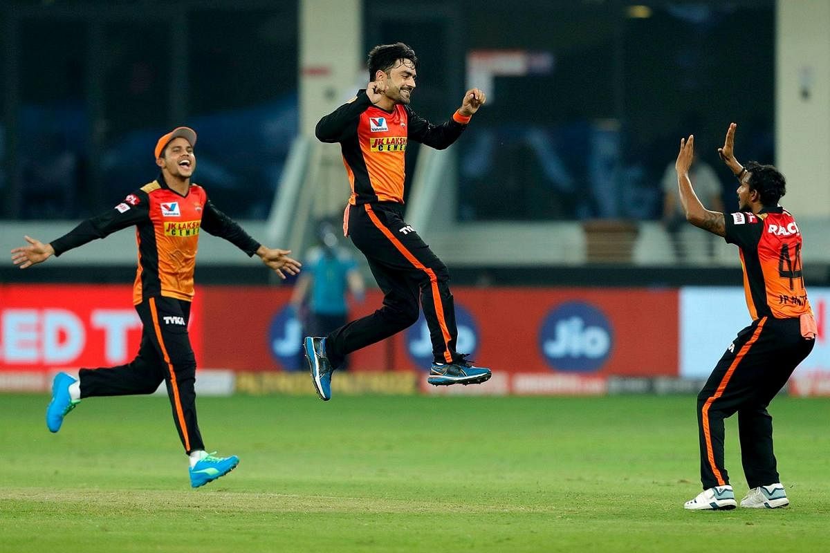 Sunrisers Hyderbad player Rashid Khan and his teammates celebrate the wicket of Kings XI Punjab batsman. Credit: PTI Photo