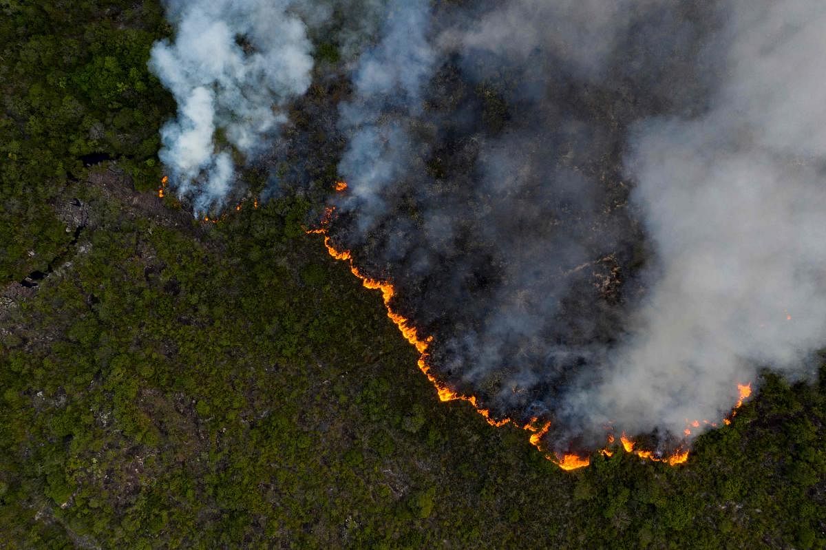 Aerial view showing a fire at the Chapada Diamantina National Park, between the cities of Andarai and Mucuge, in Bahia state, northeastern Brazil. Chapada Diamantina National Park preserves areas of three Brazilian biomes: Mata Atlantica, Cerrado and Caatinga among its 152,000 hectares. Credit: AFP Photo