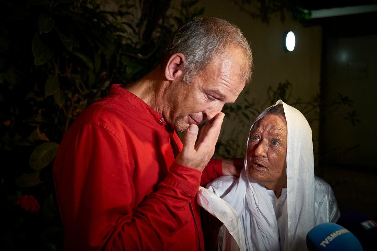 French ex-hostage Sophie Petronin, who was released and flew to Bamako, is seen with her son Sebastien Chadaud Petronin during a press conference. An elderly French aid worker and a top Malian politician landed in the capital Bamako to an emotional reunion with their loved ones after being released from captivity by presumed jihadists. Mali announced the release of Frenchwoman Sophie Petronin, 75, and Malian politician Soumaila Cisse on Thursday, alongside two Italian nationals. Credit: AFP Photo