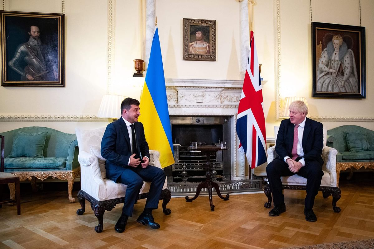 Britain's Prime Minister Boris Johnson (R) and Ukraine's President Volodymyr Zelensky gesture during their meeting inside number 10 Downing Street, in central London. Credit: AFP Photo