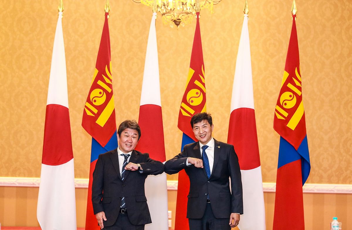 Japanese Foreign Minister Toshimitsu Motegi (L) is greeted by Mongolian Foreign Minister Nyamtseren Enkhtaivan in Ulaanbaatar, the capital of Mongolia. Credit: AFP Photo