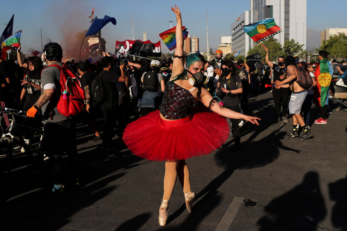 A ballerina wearing a gas mask performs as demonstrators take part in a protest against Chile's government, in Santiago, Chile. Credit: Reuters Photo