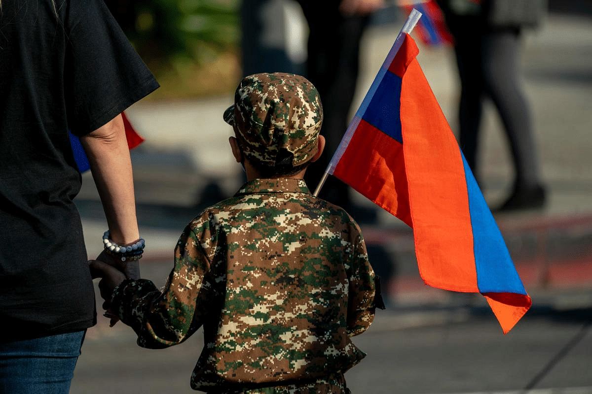 A boy holding a National Armenian flag marches with others from Pan Pacific Park to the Consulate General of Turkey, during a protest in support of Armenia and Karabakh amid the territorial dispute with Azerbaijan over Nagorno-Karabakh, in Los Angeles, California. Credit: AFP Photo