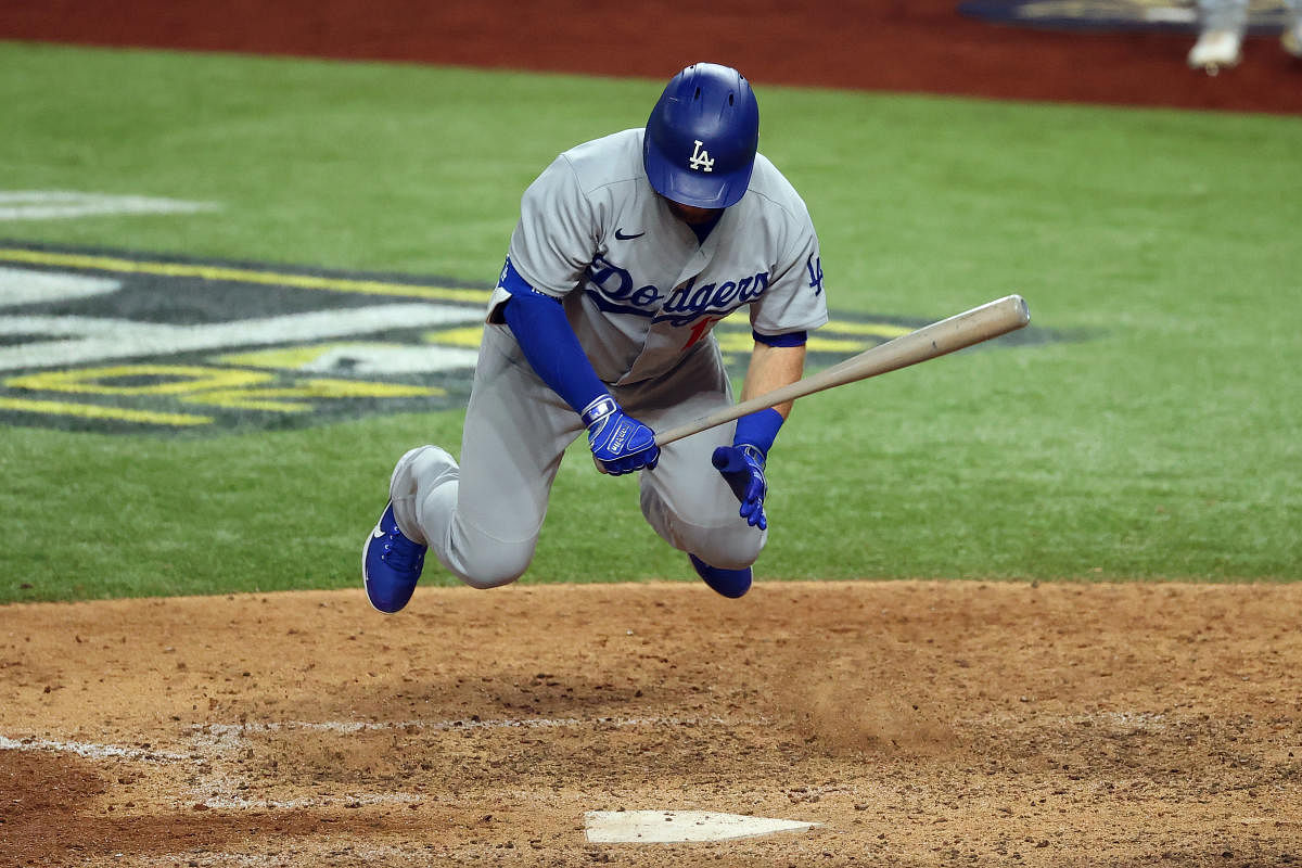 Los Angeles Dodgers first baseman Max Muncy (13) jumps out of the way of an inside pitch against the Atlanta Braves during the eighth inning of game three of the 2020 NLCS at Globe Life Field. Credit: USA Today Sports Photo