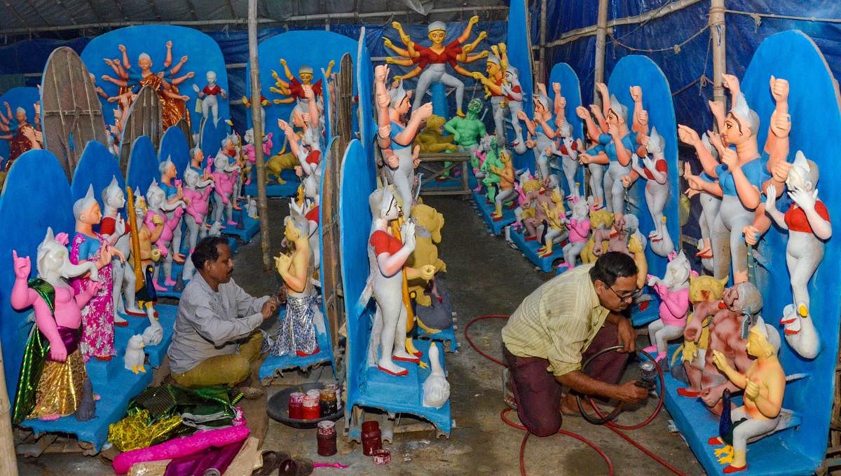 Artists give final touch to idols of Goddess Durga ahead of Durga Puja festival, in Ranchi. Credit: PTI Photo