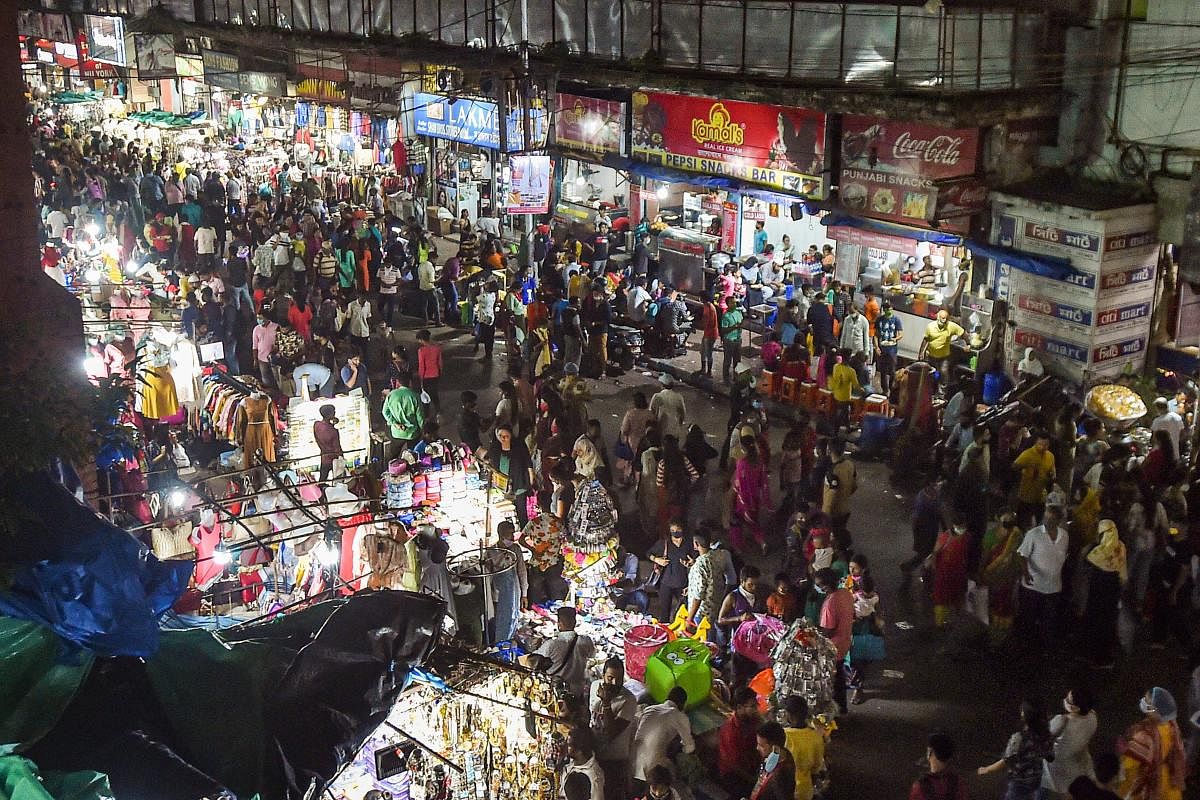 People visit a crowded market ahead of Durga Puja festival, in Kolkata. Credit: PTI Photo