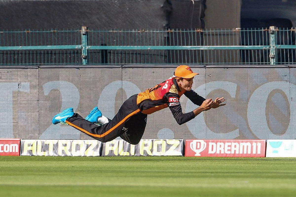 Priyam Garg of Sunrisers Hyderabad takes a catch of Shubman Gill of Kolkata Knight Riders during Indian Premier League (IPL) T20 cricket match, at the Sheikh Zayed Stadium in Abu Dhabi. Credit: PTI Photo