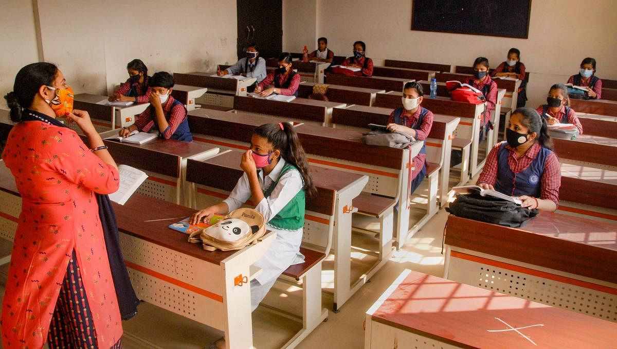Students attend a class in Noida. Credit: PTI