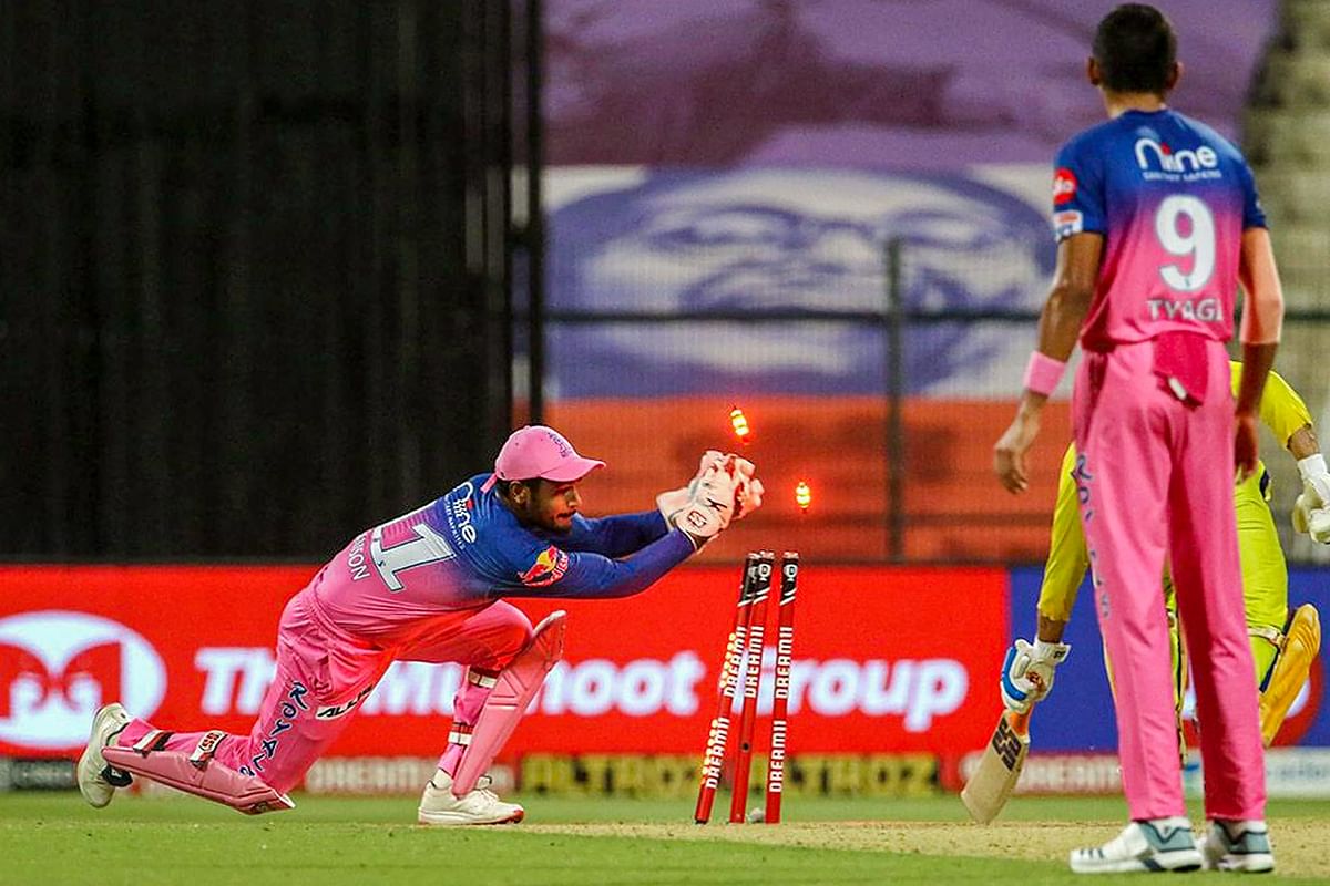 Rajasthan Royals player Sanju Samson run outs Chennai Super Kings batsman MS Dhoni. Credit: PTI Photo