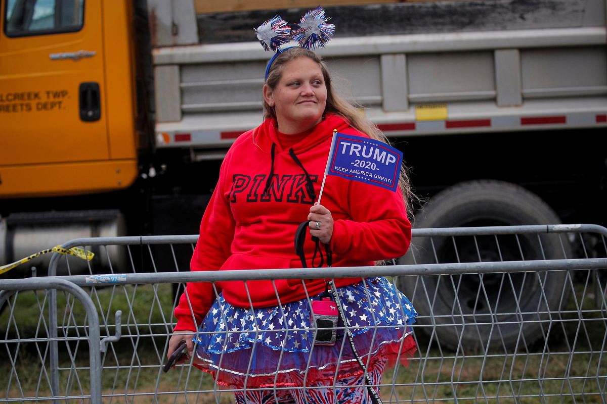 A supporter of US President Donald Trump waits in line to attend his campaign event at Erie International Airport in Erie, Pennsylvania. Credit: Reuters Photo