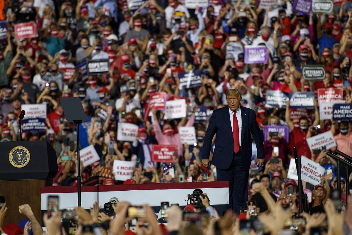 President Donald Trump makes arrives to a crowd of several thousand rally goers at Gastonia Municipal Airport. Credit: AFP Photo