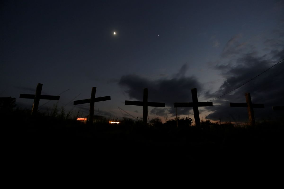 Crosses that represent 65 miners who died during an explosion in 2006 in Pasta de Conchos coal mine, are seen along a highway in San Juan de Sabinas, Mexico. Credit: Reuters Photo