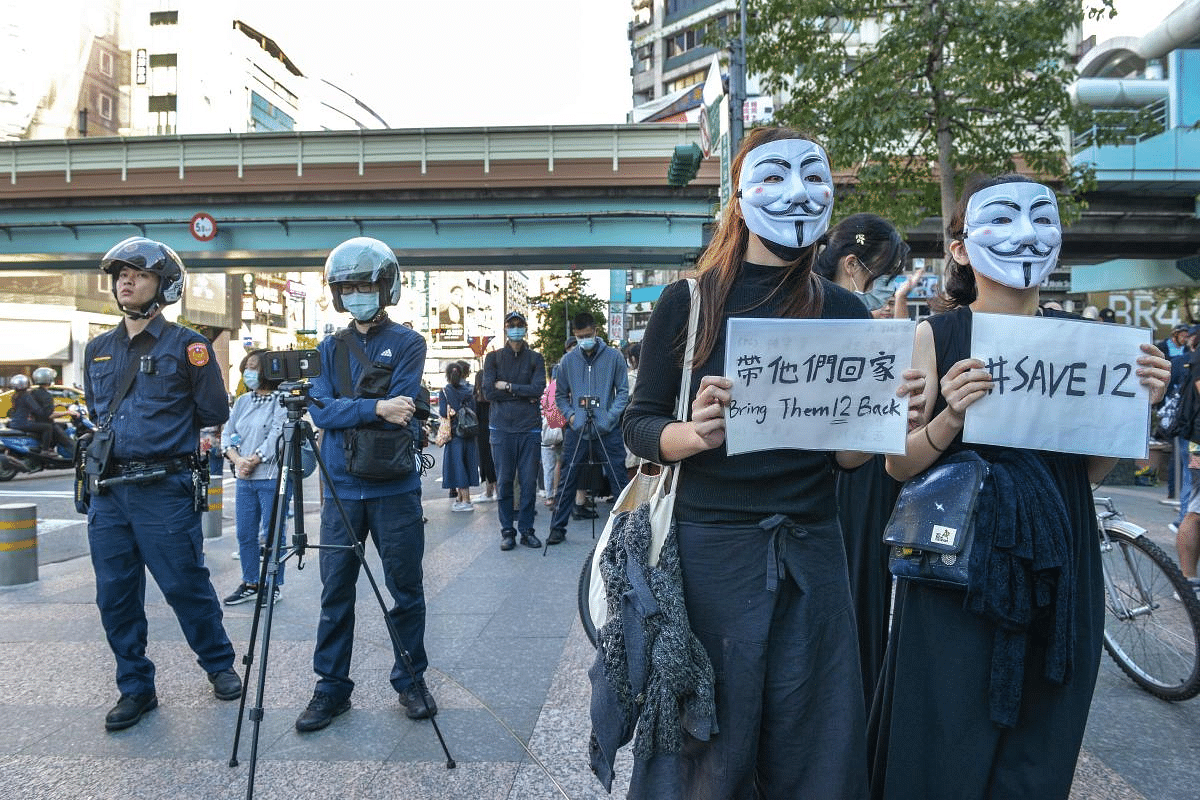 People march in support of Save12, the campaign to save twelve Hong Kong pro-democracy activists who on August 23 were caught by mainland Chinese authorities trying to flee Hong Kong to Taiwan by boat, in central Taipei. Credit: AFP Photo