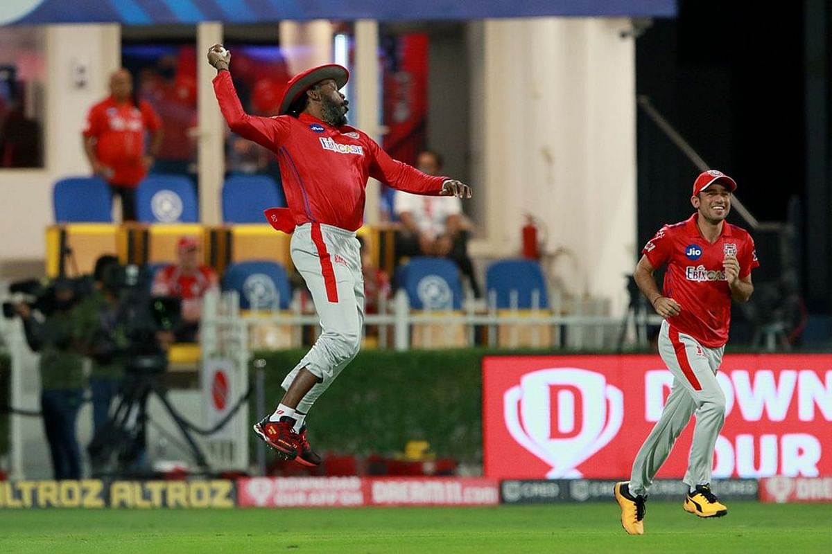 Chris Gayle of Kings XI Punjab celebrates after taking a catch of Nitish Rana of Kolkata Knight Riders during match 46 of season 13 of the Indian Premier League (IPL ) between the Kolkata Knight Riders and the Kings XI Punjab held at the Sharjah Cricket Stadium, Sharjah in the United Arab Emirates on the 26th October 2020. Credit: iplt20.com/BCCI