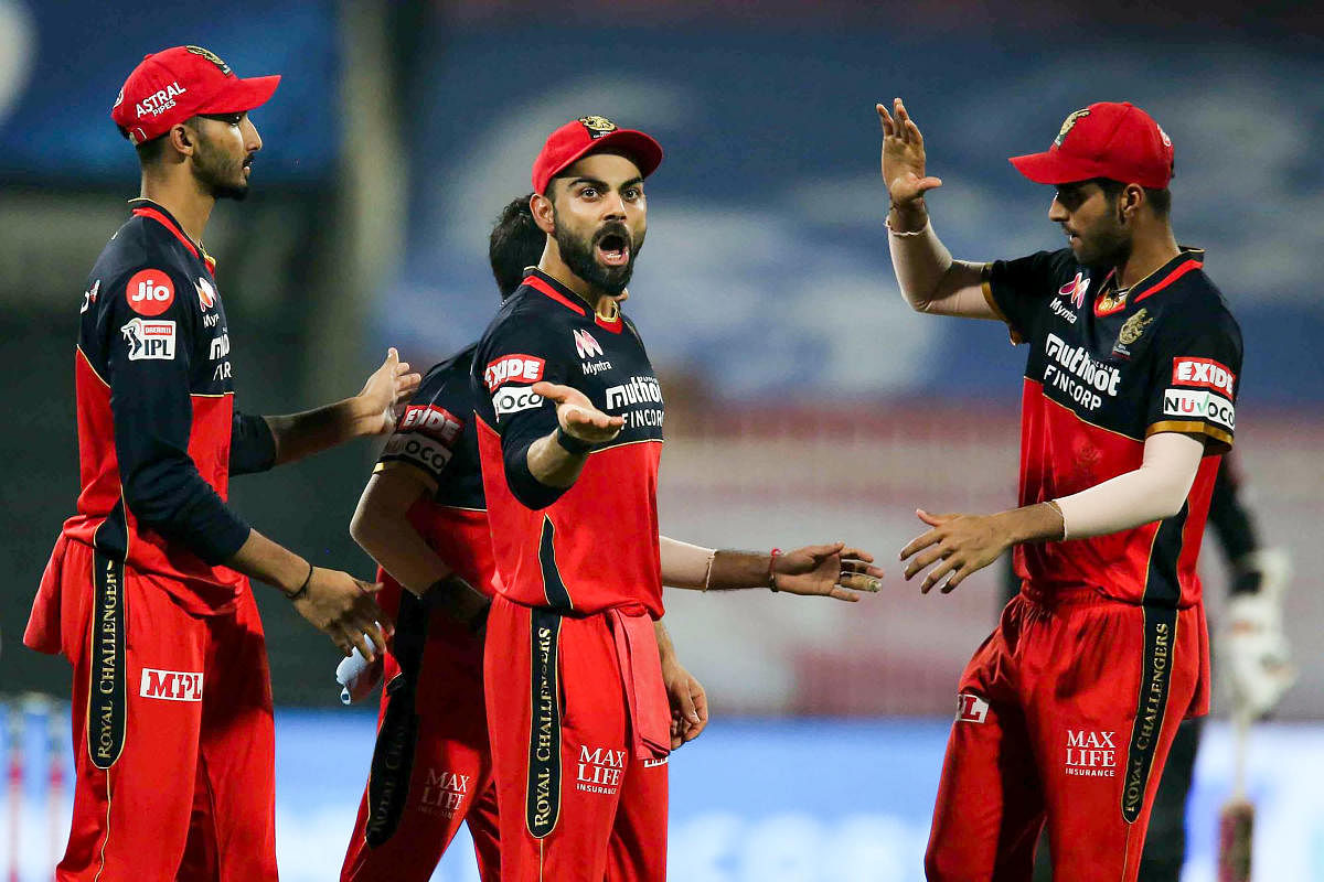 Royal Challengers Bangalore captain Virat Kohli celebrates the wicket of Sunrisers Hyderabad batsman Manish Pandey. Credit: PTI Photo