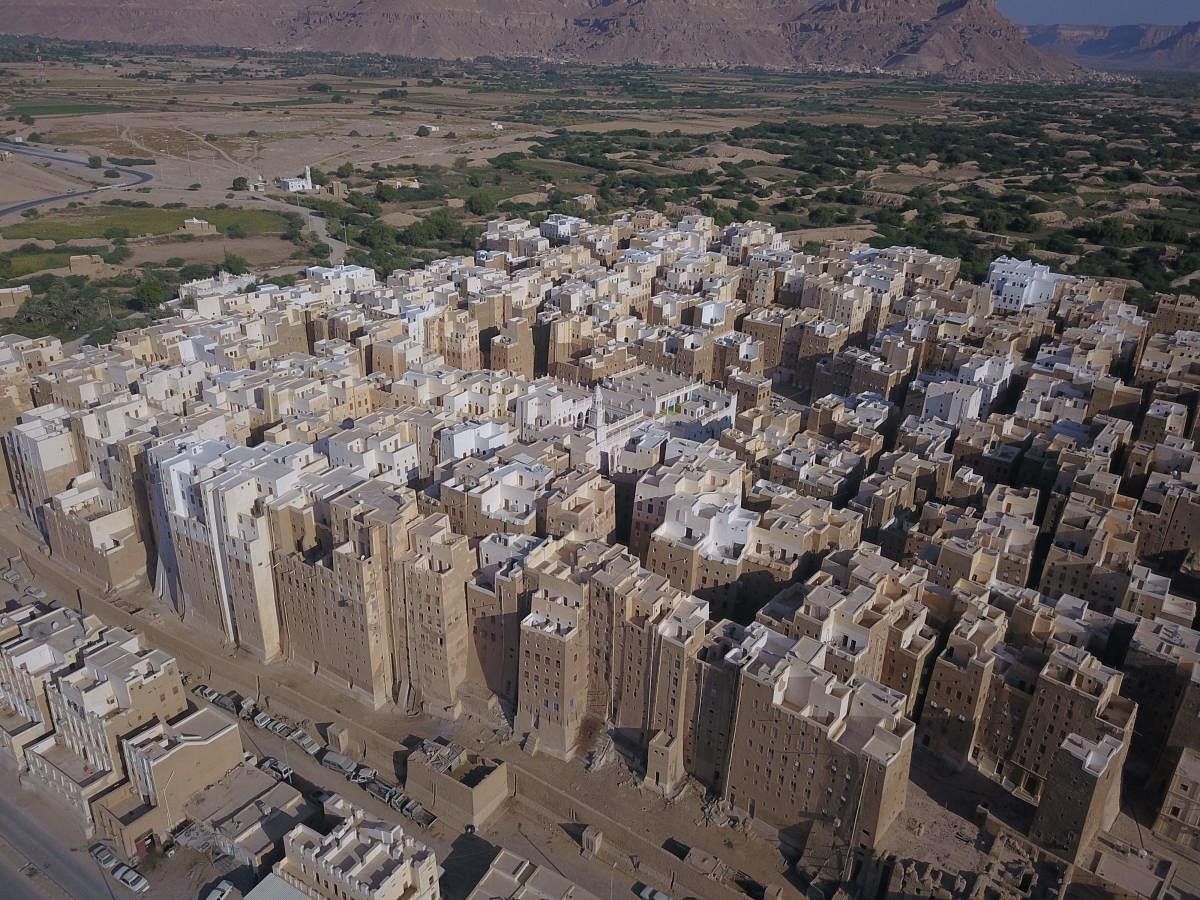 Against the backdrop of what resembles the Grand Canyon stands Yemen's ancient city of Shibam, the 'Manhattan of the desert' that has largely been spared by war but remains at the mercy of natural disasters. Credit: AFP Photo