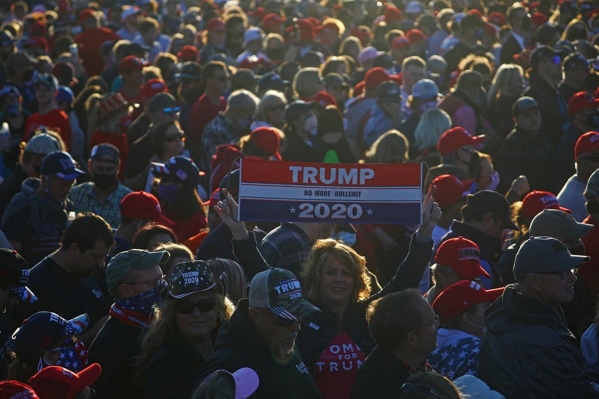 Supporters attend a campaign rally by US President Donald Trump at Hickory Regional Airport in Hickory, North Carolina US. Credit: Reuters Photo