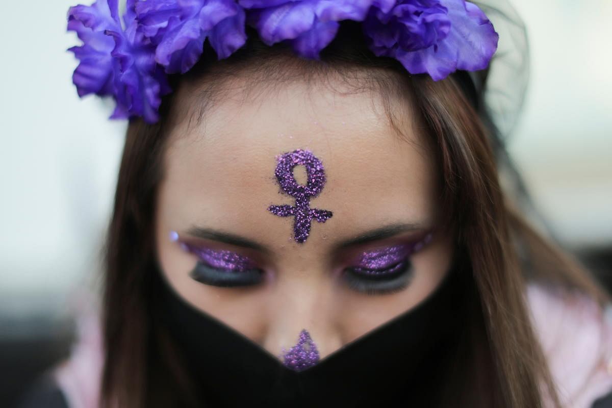 A woman wears a face mask during a protest on the Day of the Dead against gender violence and femicide, in Mexico City. Credit: Reuters Photo