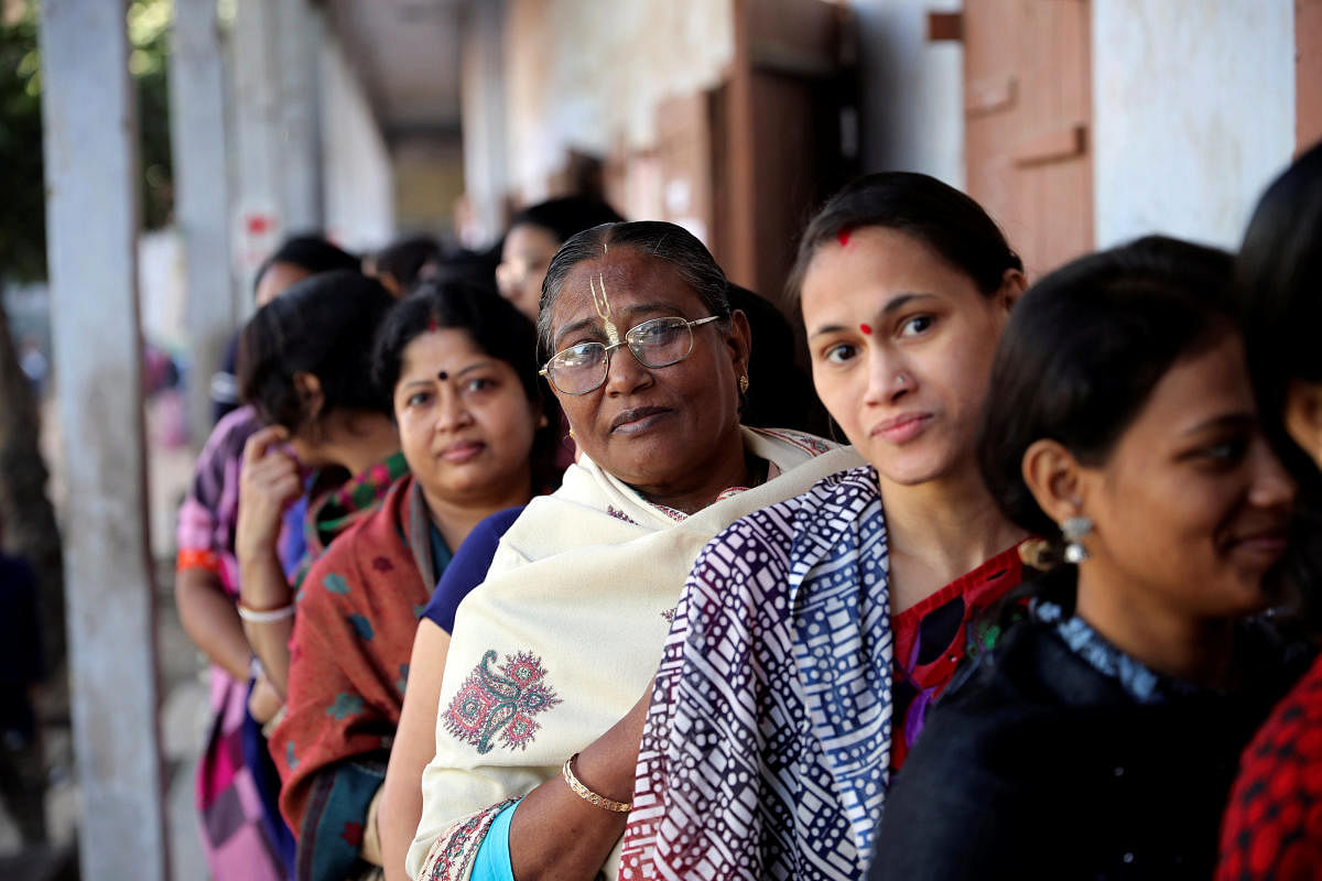  Voters wait to cast their vote outside a voting center during the general election in Dhaka. Bangladesh saw a voter turnout of 78.1% in its 2018 elections. Credit: Reuters Photo