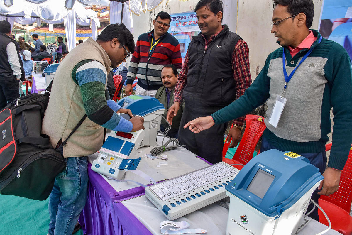Polling officials collect EVM machines and other polling materials. India's voter turnout, in its 2019 general elections, was 68.8%. Credit: PTI Photo