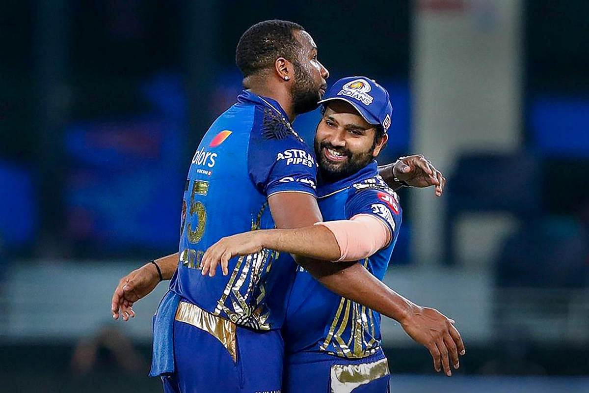 Skipper Rohit Sharma and Kieron Pollard of Mumbai Indians celebrate their win over Delhi Capitals in the Qualifier 1 match at the Indian Premier League (IPL) 2020. Credit: PTI Photo