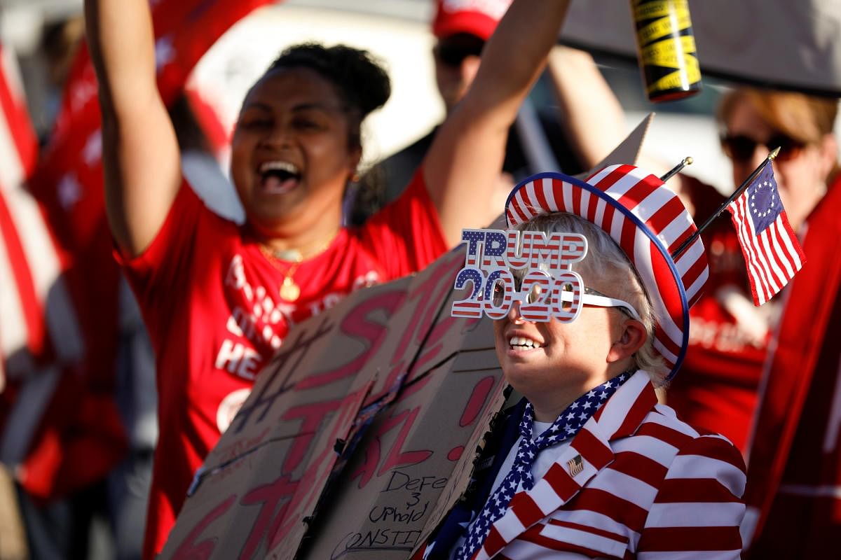 Supporters of US President Donald Trump react during a protest about the early results of the 2020 presidential election, in front of the Maricopa County Tabulation and Election Center. Credit: Reuters Photo