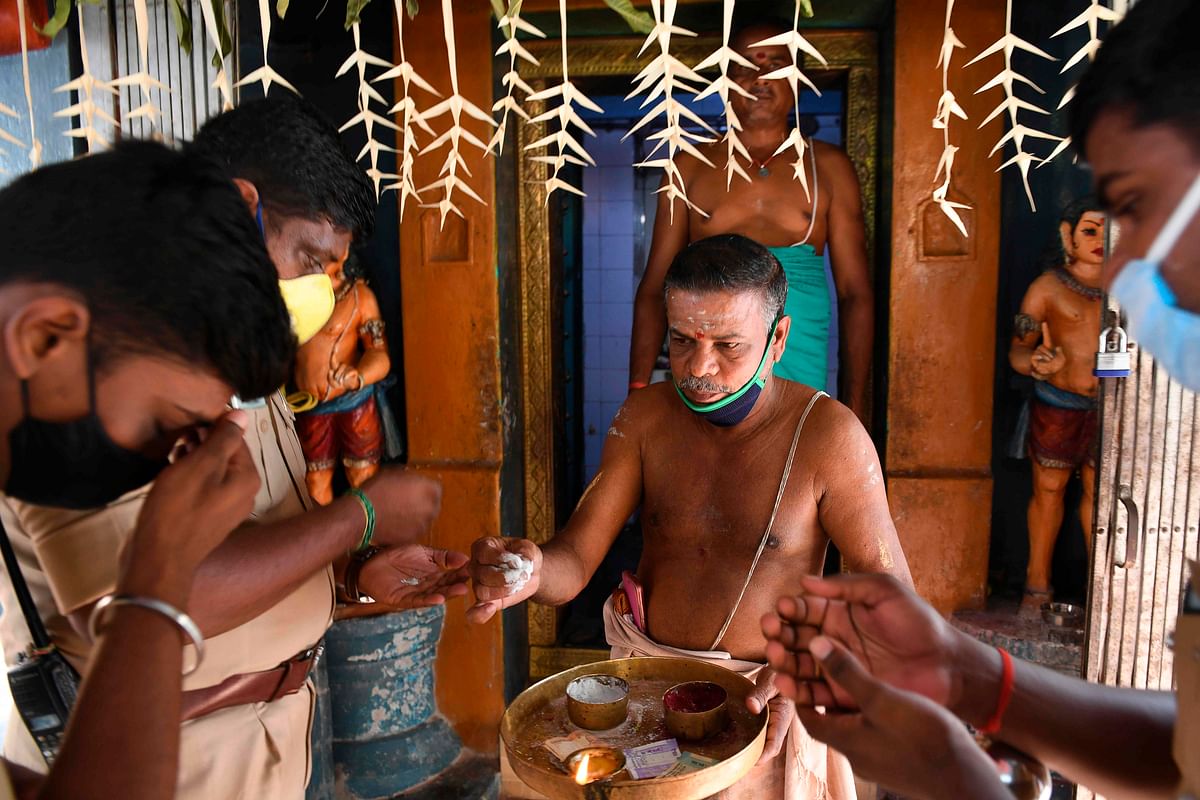 While nearly 100 people took part in the two abhishekams, more than 200 people had their lunch at the temple premises at the mass feeding ceremony. Credit: AFP Photo