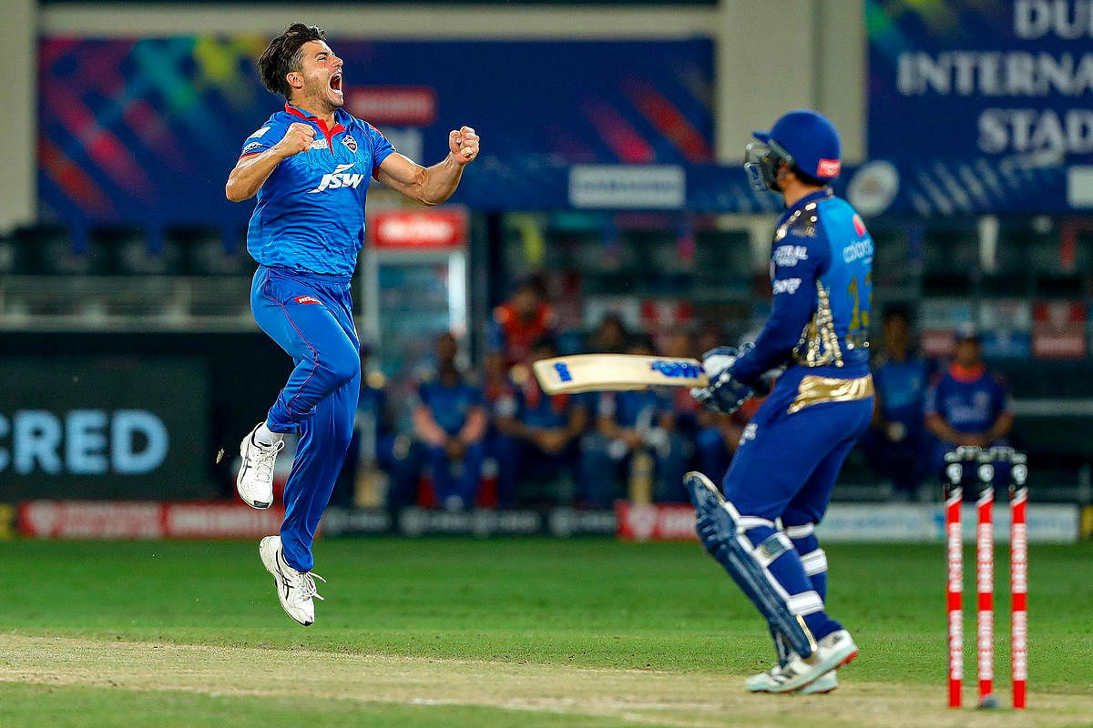 Delhi Capitals player Marcus Stoinis celebrates the wicket of Mumbai Indians batsman Quinton de Kock. Credit: PTI Photo