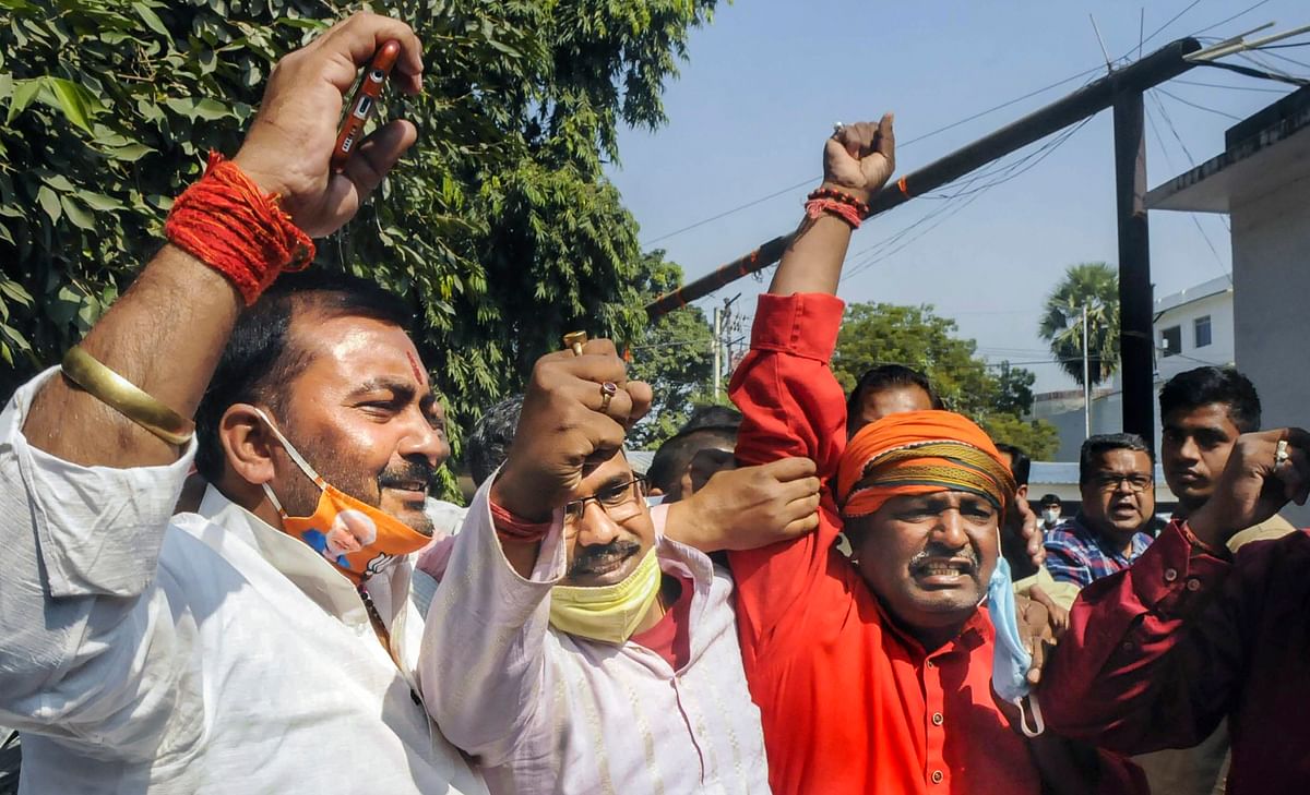Janata Dal (United) supporters react as officials count votes during counting day of Bihar Assembly polls, in Patna. Credit: PTI Photo