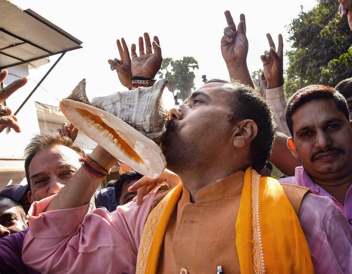 BJP supporters celebrate NDA's lead during the counting of votes for the Bihar Assembly Elections results. Credit: PTI Photo