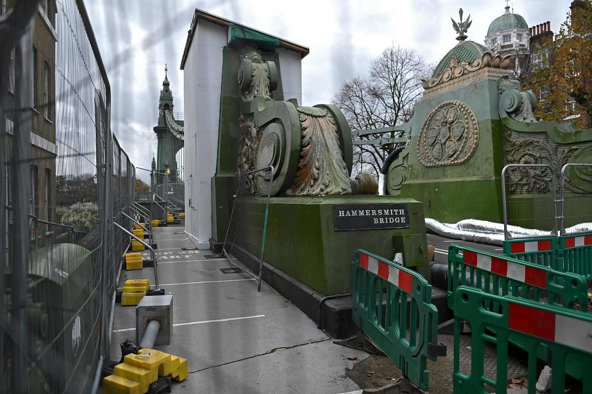 Work is underway to repair the 133 year old Hammersmith Bridge over the River Thames in west London. Hammersmith Bridge opened to the public 133 years ago during the reign of Queen Victoria and was originally designed to carry horse-drawn carts. The bridge was closed to traffic in April 2019 because of fractures in its cast iron structure. River traffic has even been banned from passing underneath due to fears of a sudden collapse, prompting questions about the upkeep of London's bridges. Credit: AFP Photo