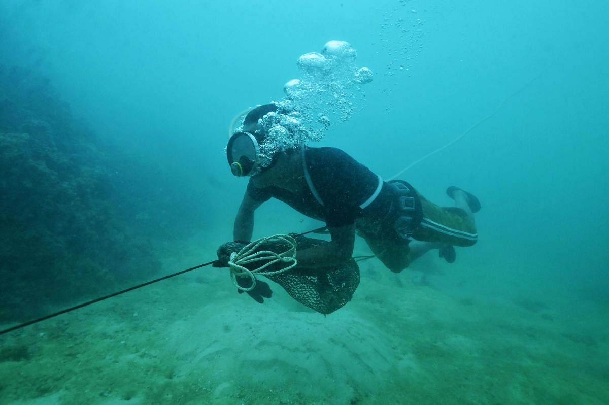 Moken fisherman Sanam Changnam hunting for fish off the coast of the southern Thai island of Phuket. Coronavirus has wrought havoc across the world, but for Thailand's